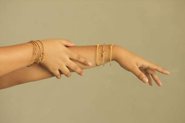 Gold Twisted Bangles Worn on Hand