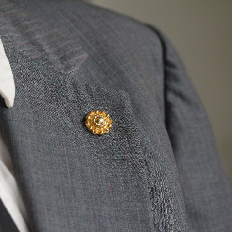 Bernie Filigree Lapel Pin Gold Close Up On Suit