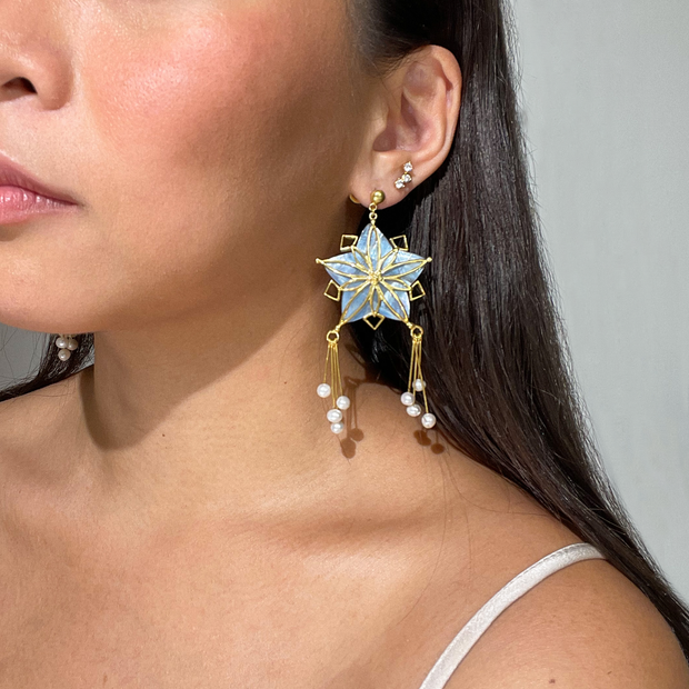 Blue Gold Parol Shell Earrings on A Model