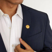 Brigido Gold Lapel Pin Worn on Blue Suit