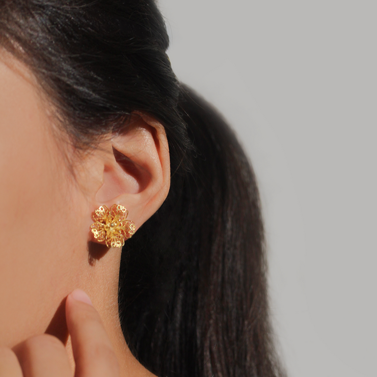 On model, gold Carnation Drop Earrings (stud only)