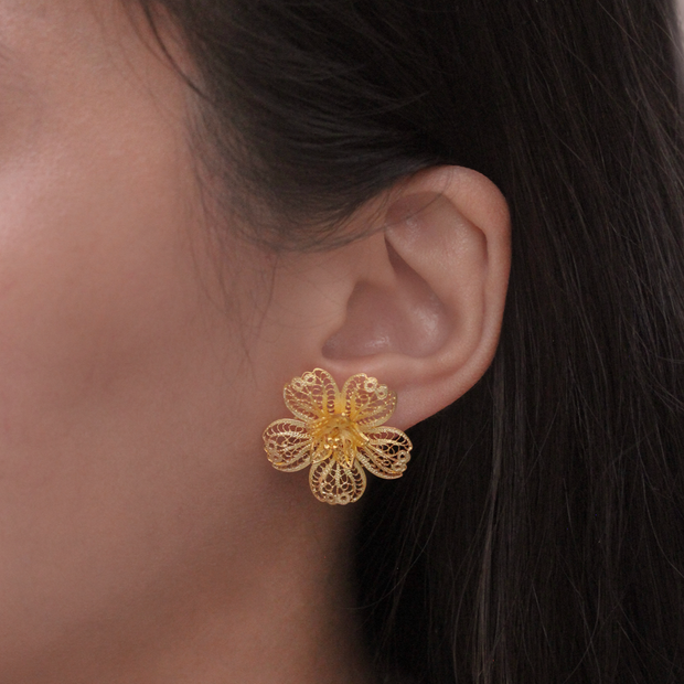 On model, gold Carnation stud earring