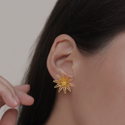 On model, Gold Dasyanas stud earrings