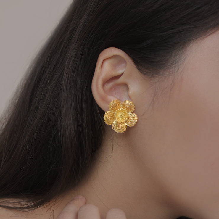On model, Large Gold Gumamela stud earrings