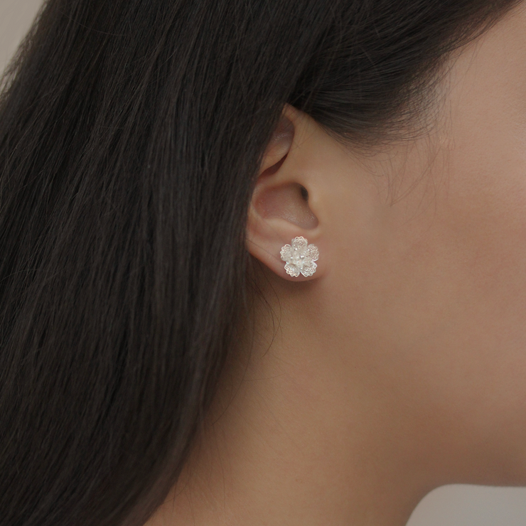 On model, Silver Gumamela stud earrings