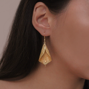 On model, Gold Liryo Calla Lily Drop Earrings