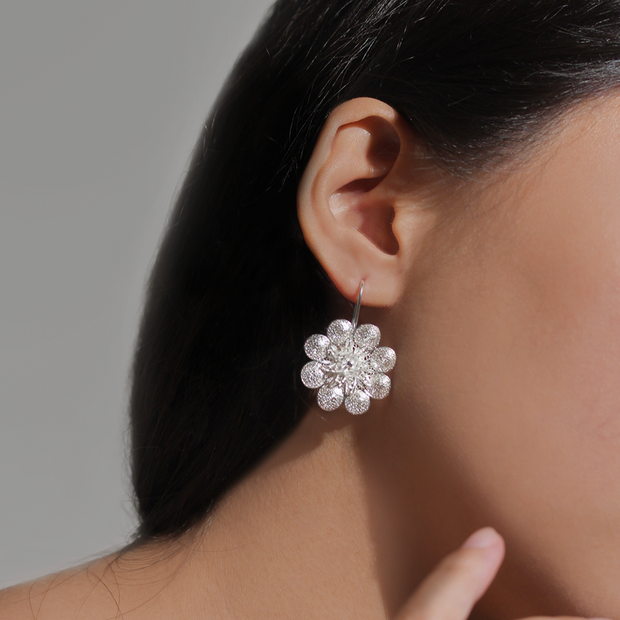 On model, silver Repolyo Rosa Filigree Hook Earrings