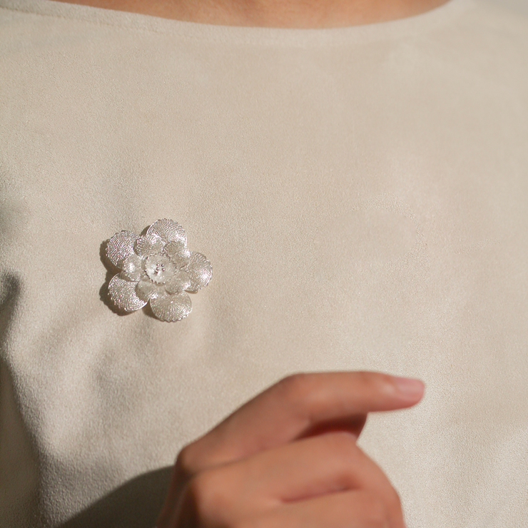 On model, silver Rosa Filigree Brooch