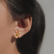 On model, gold Sampaguita Filigree Stud Earrings