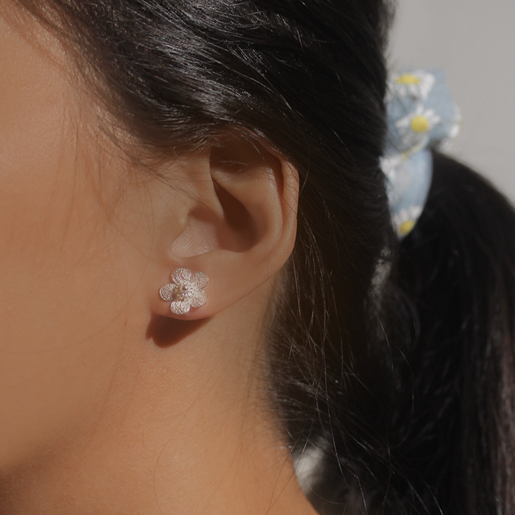 On model, silver Sampaguita Filigree Stud Earrings